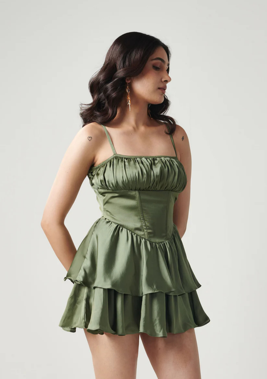 Siora structured green satin mini dress featuring ruffled layers and rushing on the bust—playful pick for cocktail nights or casual glam outings.