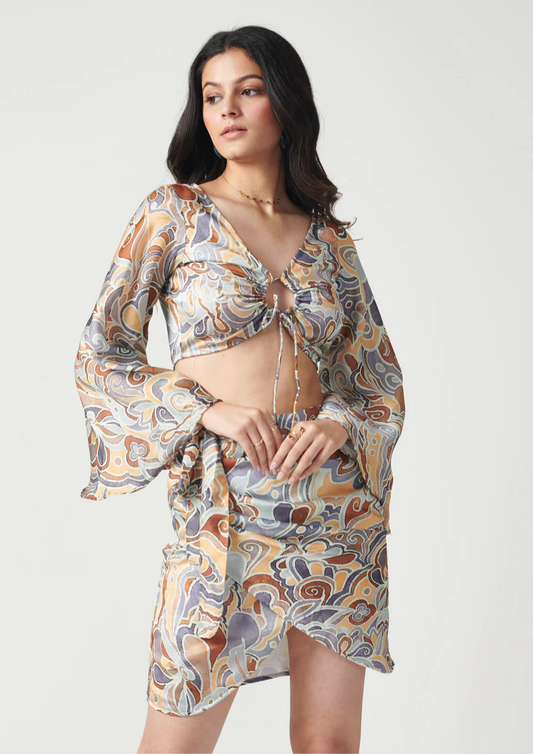 Siora printed wrap-style skirt in soft semi satin georgette—adds charm and comfort to any day-to-night look.