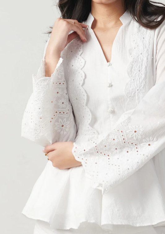 Siora lightweight white cotton top featuring beautiful chikankari work on flared sleeves—ideal for summer getaways, garden parties, and casual festive events.