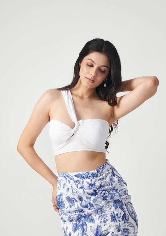 Siora two-piece floral co-ord set featuring a blue print on white crop top and adjustable string skirt in lightweight georgette fabric.