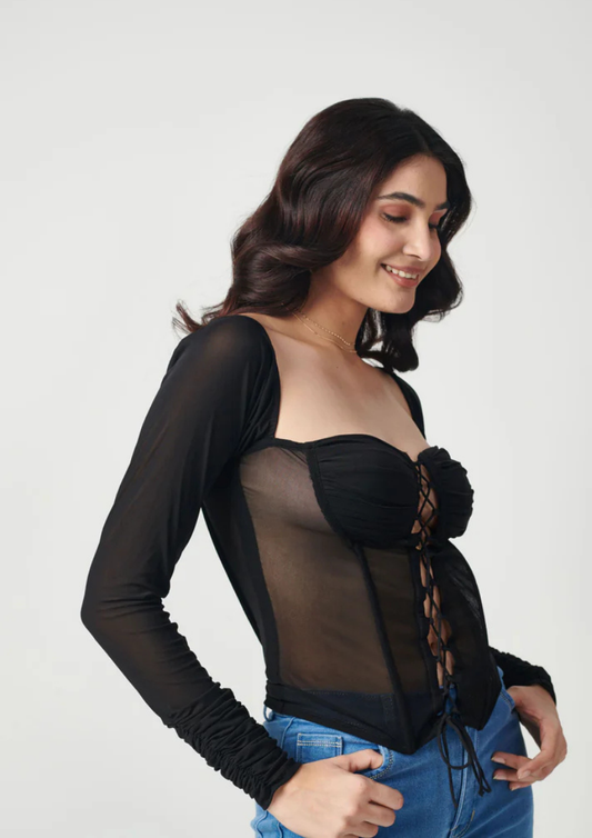 "Siora sheer mesh black top with structured boning and eye-catching front criss-cross design—ideal for statement party looks.
"