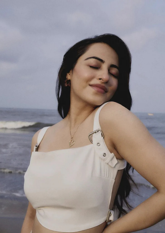 Siora chic white buckle crop top in banana crepe with shoulder details and back strap—ideal for casual outings, summer vacations, or fashion-forward events.