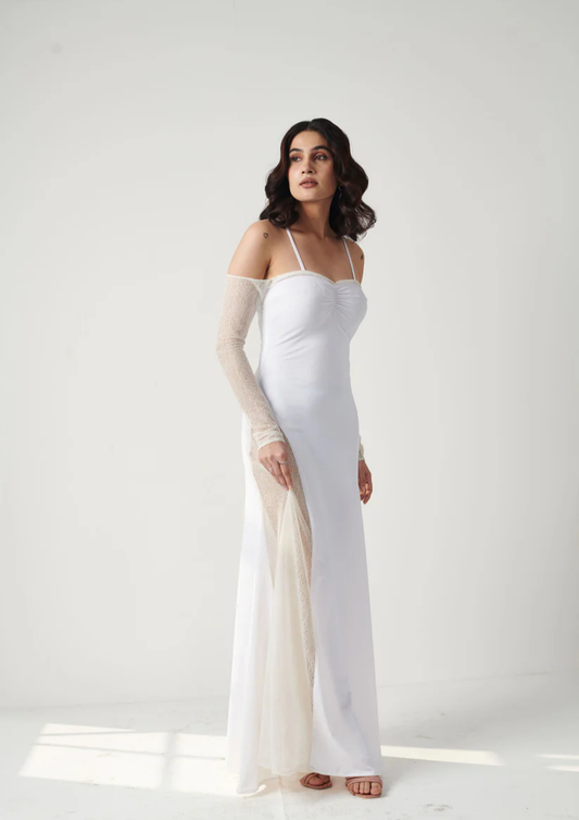 Siora elegant white gown in lycra with sheer cream net detail and seamless fit—ideal for holiday events, winter balls, and glamorous occasions.