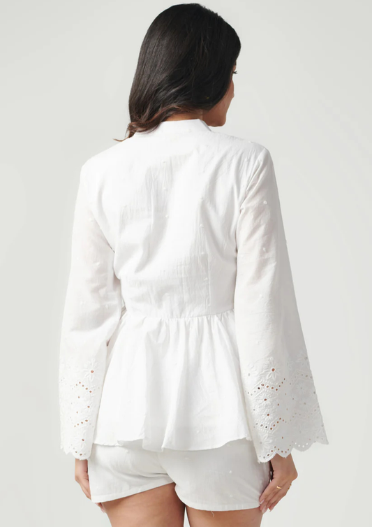 Siora breezy white co-ord set featuring cotton fabric and intricate chikankari details on flared sleeves—ideal for holiday getaways, pool parties, and daytime outings.