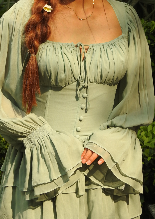 Siora Elowen Corset Dress in sea green – romantic georgette silhouette with gathered bustier, flowing frilled sleeves, and tiered layers for a breezy, ethereal look.