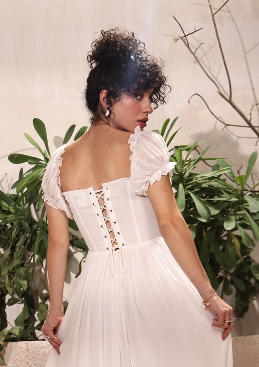 Seora elegant white gown with a sweetheart neckline, puff sleeves, and flared silhouette—ideal for special occasions and holiday getaways