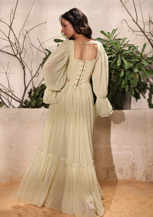 Seora Green Maxi Gown Dress with a corset bodice, frill details on the sleeves, and button accents – ideal for formal occasions, bridesmaids romantic dinners, and sophisticated evening outings.