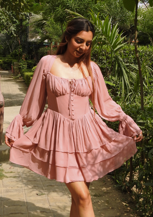 Siora Pink Corset Georgette Dress – Rosabelle silhouette featuring a sweetheart neckline, layered skirt, and frilled flare sleeves, ideal for spring weddings or brunch dates.