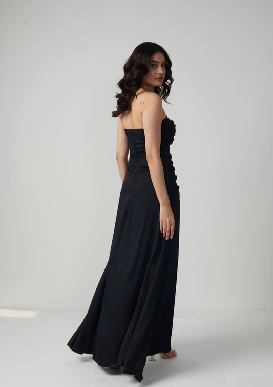 Siora elegant black satin off-shoulder maxi gown featuring pleat accents at the bust and waist—ideal for cocktail nights, black-tie events, and glamorous celebrations.