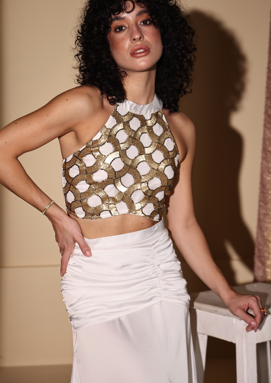 Seora Luxe sophisticated white halter top with golden embroidery, a flattering crisscross back, and luxurious soft fabric—ideal for weddings, cocktail parties, and festive gatherings