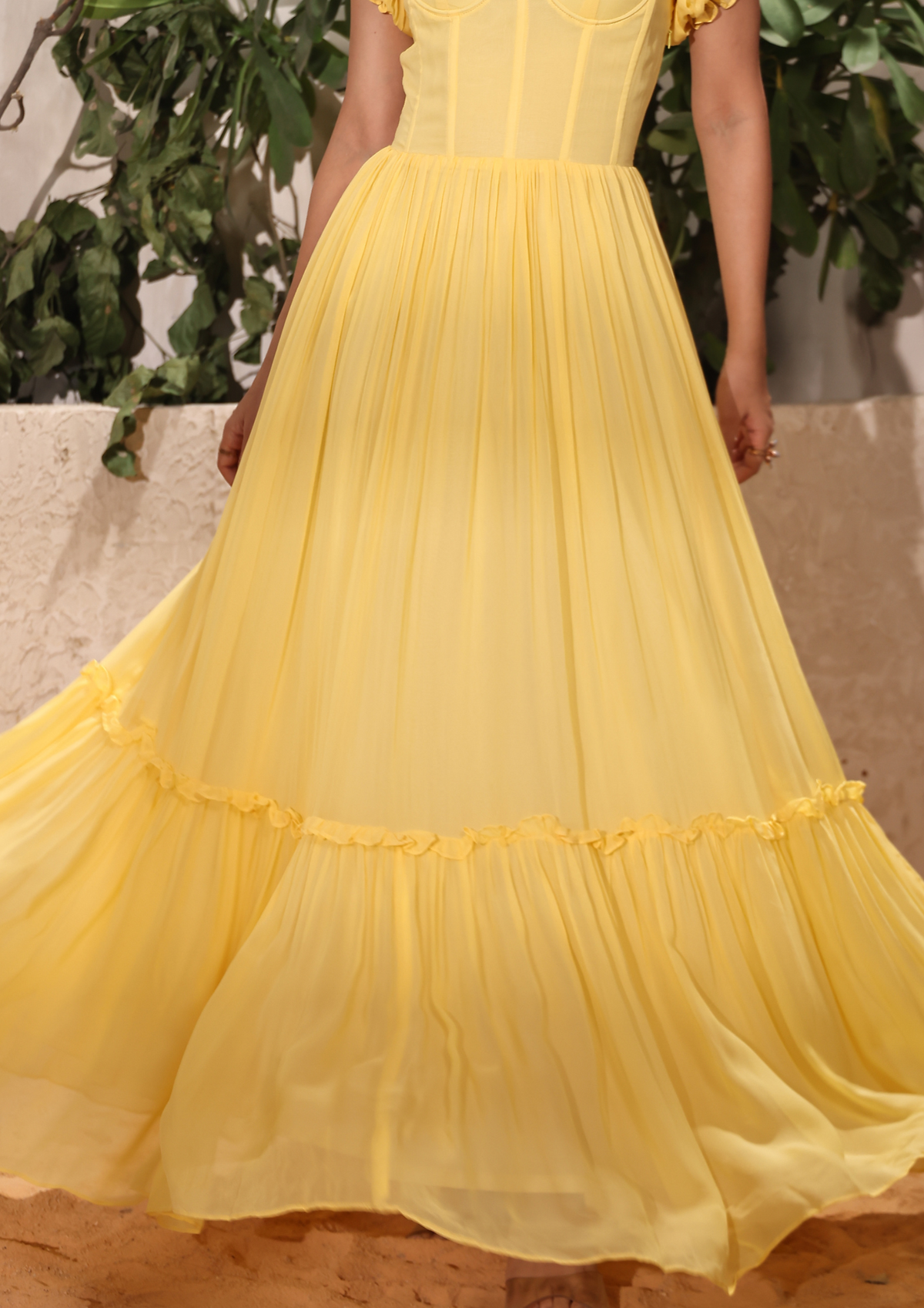 Seoraa chic yellow long dress with flairs, frills, and crisscross back—designed for vibrant Haldi celebrations, elegant birthdays, and tropical vacations