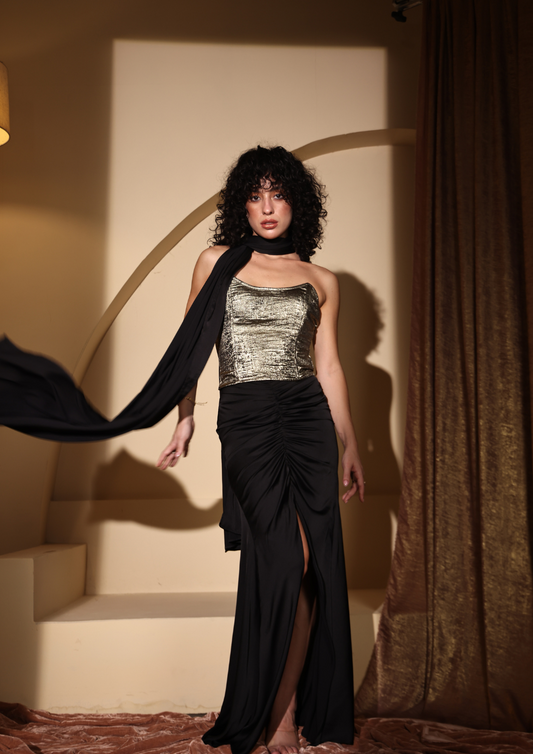 Seora Luxe elegant golden shimmer corset top paired with a black ruched slit skirt—an ideal outfit for New Year parties, festive celebrations, and evening events