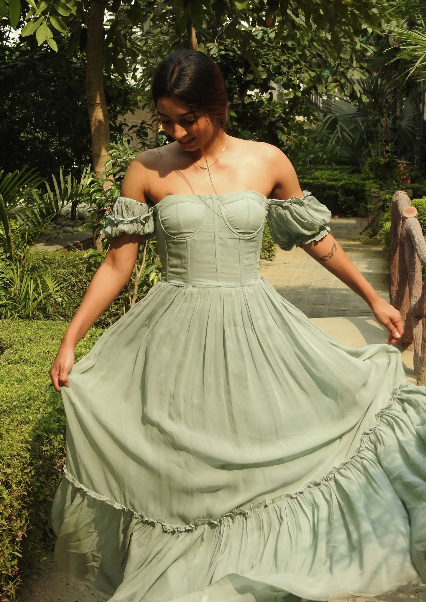 Sehora Sea Breeze Corset Dress – in seafoam green georgette, this flowing dress highlights puff sleeves, a sweetheart bodice, and soft cascading frills for a dreamy, graceful look.