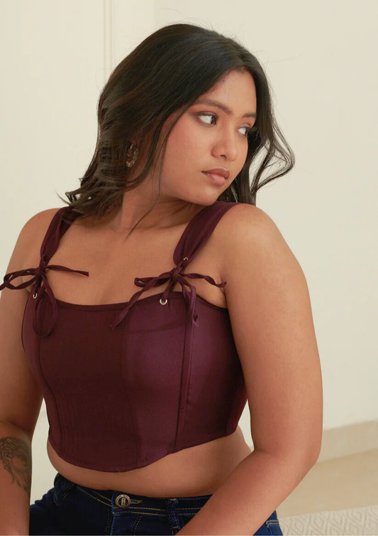 Siora stylish wine corset crop top made of soft banana crepe with a flirty back tie—ideal for dinner dates, rooftop parties, or club nights.