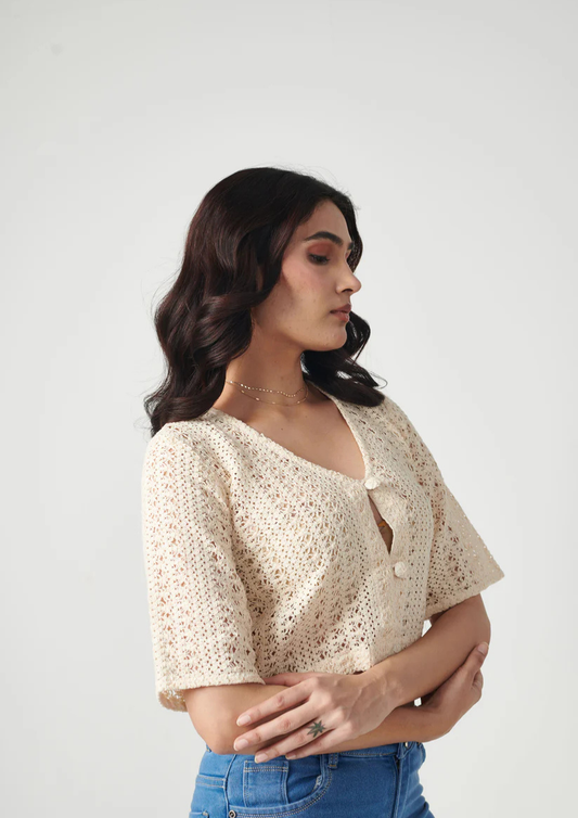 Siora stylish beige crotchet crop top featuring full sleeves and front buttons—ideal for vacations, cafe hopping, or laid-back fashion statements.