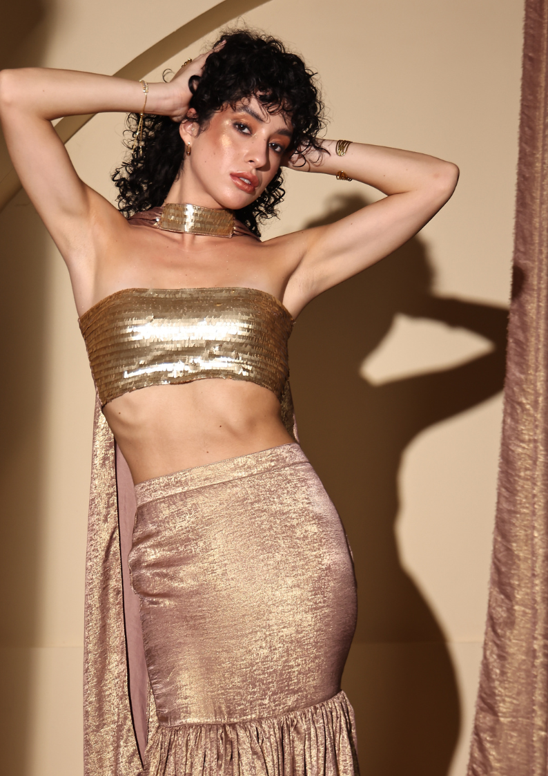 Seeora Luxe radiant Zareen Lehenga Set in gold, crafted from shimmering lurex fabric with a sequined bustier, a flowy lehenga, and a graceful dupatta—perfect for receptions, cocktail parties, and festive soirées