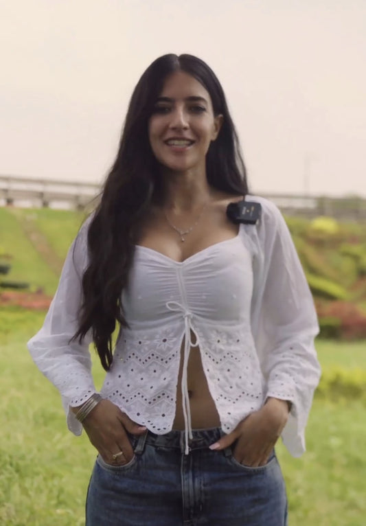 Soundous Moufakir in Seora Bella Chikankari Top - White Chikankari Cotton Top Featuring Flared Sleeves and Stylish Front Slit. Ideal for beachwear, resort outings, casual picnics, and summer vacations.