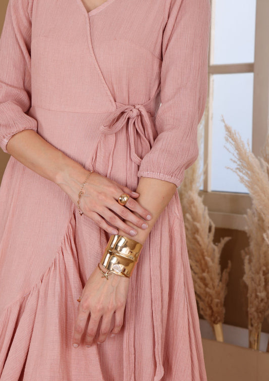 Siora Warm Peach Dress with V neckline and asymmetrical ruffle hem, perfect for sunset dates