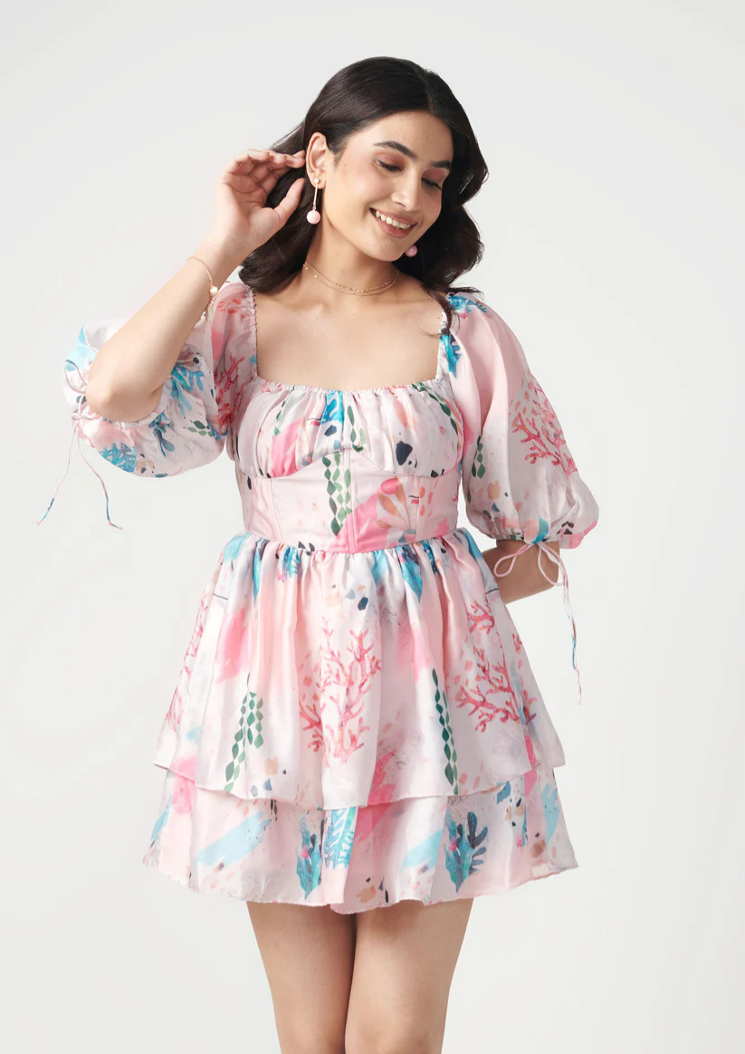 Kierra pink bustier dress in semi satin georgette with bell sleeves and low-cut tie-back—modern, stylish, and confidence-boosting.