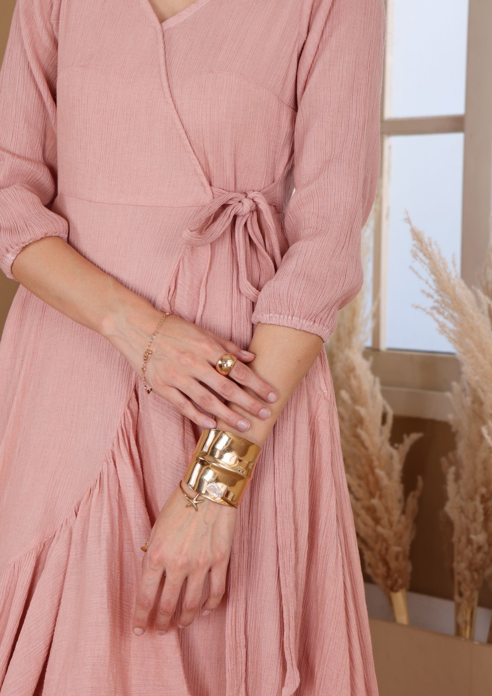 Siora Warm Peach Dress with V neckline and asymmetrical ruffle hem, perfect for sunset dates