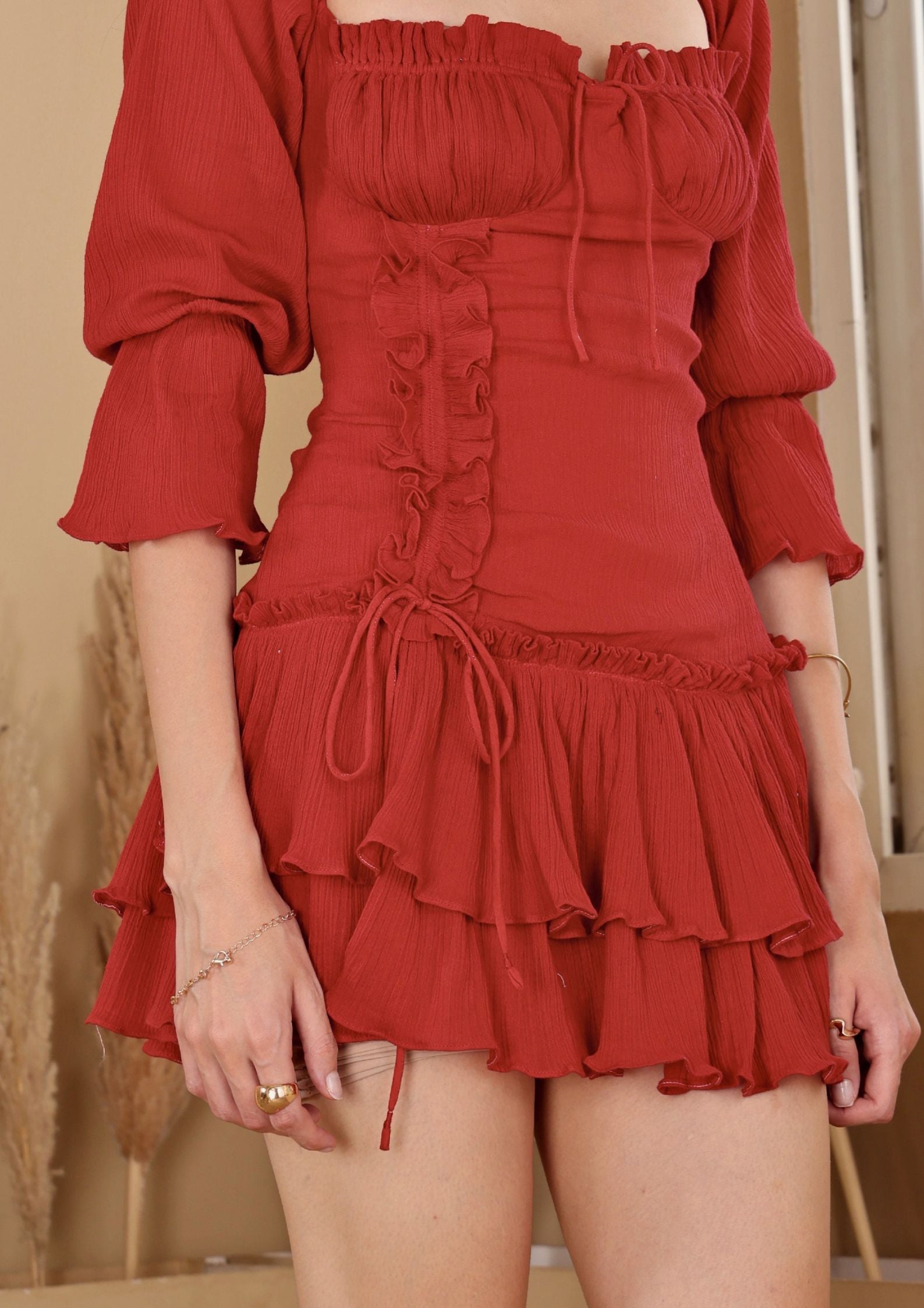 Sioraa Ruby Red Dress with layered hem and graceful ruching, perfect for special occasions